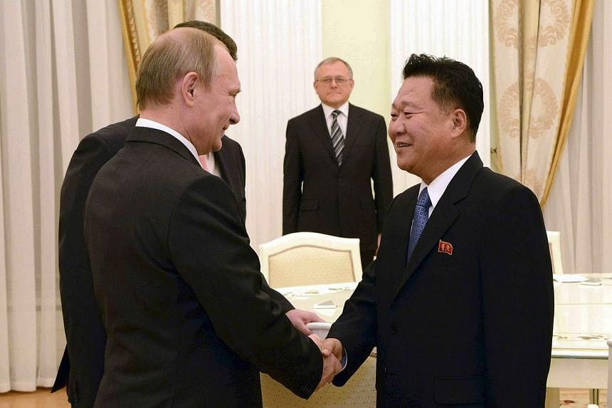 Choe Ryong Hae (right), a close aide of North Korea's leader Kim Jong Un, meets with Russia's President Vladimir Putin in Moscow in this Nov 18, 2014, photo released by North Korea's Korean Central News Agency (KCNA) on Wednesday.&nbsp;-- PHOTO: REUT