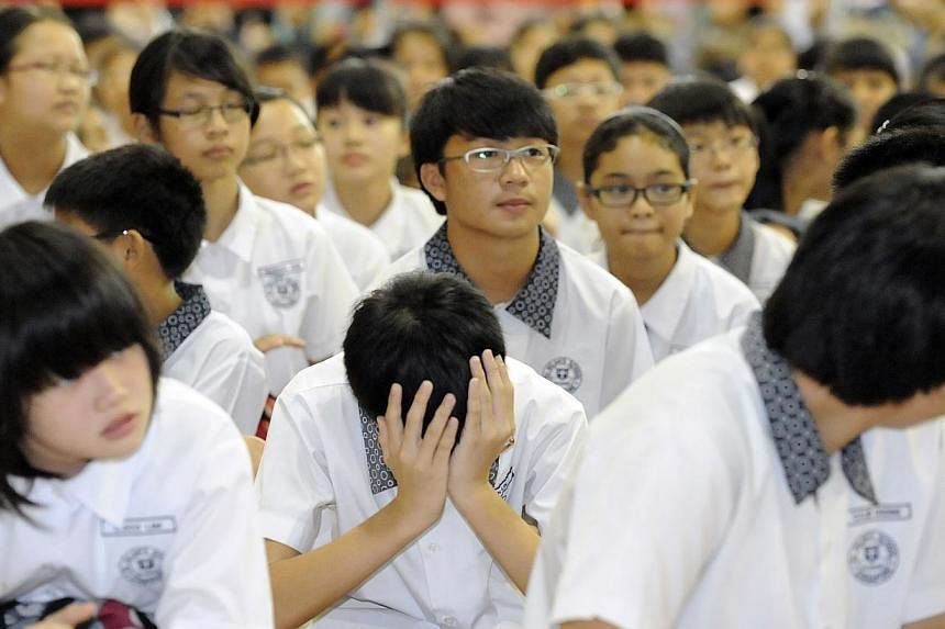 St Hilda's Primary School pupils waiting for their Primary School Leaving Examination (PSLE) results to be announced on Nov 24, 2011. -- PHOTO: ST FILE