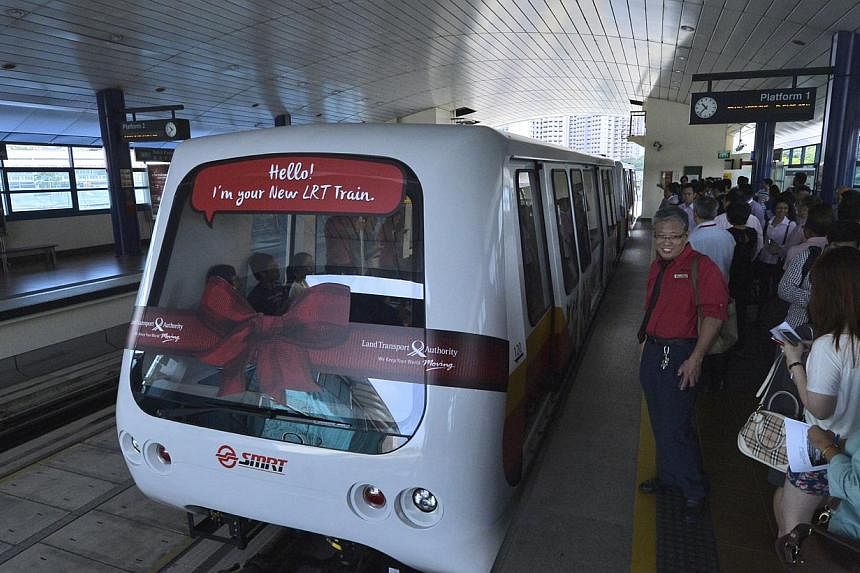 The Bukit Panjang LRT system's new train cars have more handrails and strap-hangers, as well as an air-con system that provides better air flow in the cabin and solar windshields to keep commuters cool.