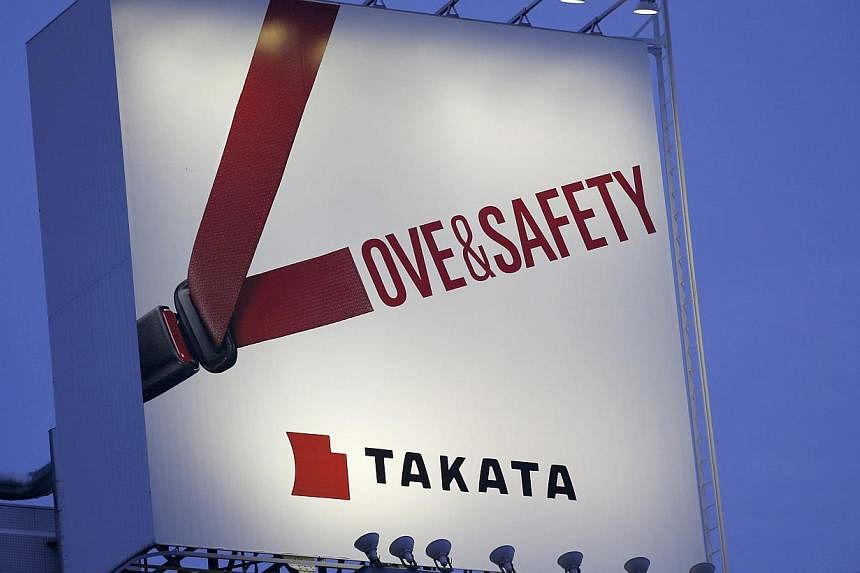A Takata billboard advertisement is pictured in Tokyo on Sept 17, 2014. Shards from a ruptured Takata-made airbag killed the driver of a Honda Accord after a traffic accident in Florida, according to the final autopsy report, the first official confi
