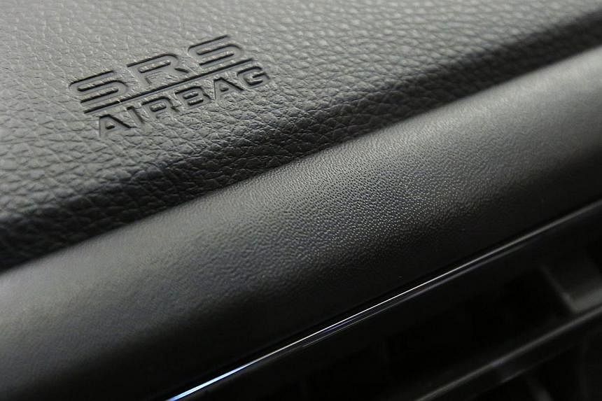 An airbag logo is seen on a dashboard of a Honda Motor Co's car. More than 11 million vehicles in the United States and 17 million globally have been recalled for the potentially defective Takata air bags. -- PHOTO: REUTERS