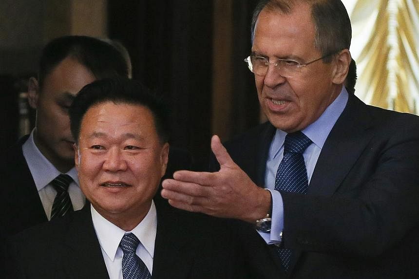 Russia's Foreign Minister Sergei Lavrov (right) shows the way to Choe Ryong Hae, a close aide of North Korea's leader Kim Jong Un, during a meeting in Moscow, Nov 20, 2014. Russia on Thursday shrugged off reports that North Korea may be firing up a f