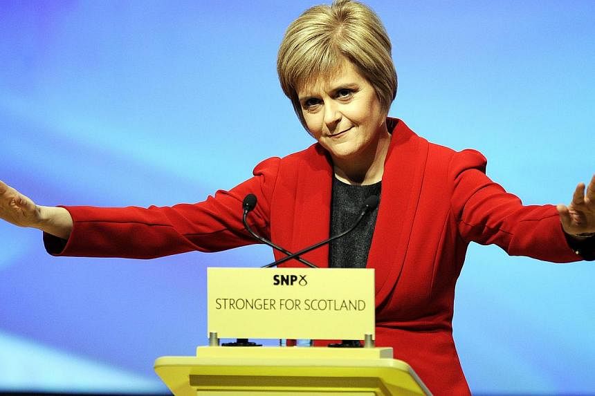 Nicola Sturgeon (above) was named as Scotland's First Minister on Wednesday with a vote in the region's parliament, becoming the first woman to take on the role. -- PHOTO: AFP