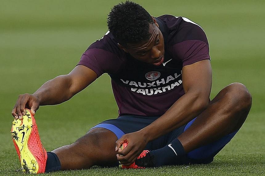 Liverpool striker Daniel Sturridge (above) may not return until the new year after it was announced Wednesday that the England forward had suffered a fresh thigh injury. -- PHOTO: REUTERS