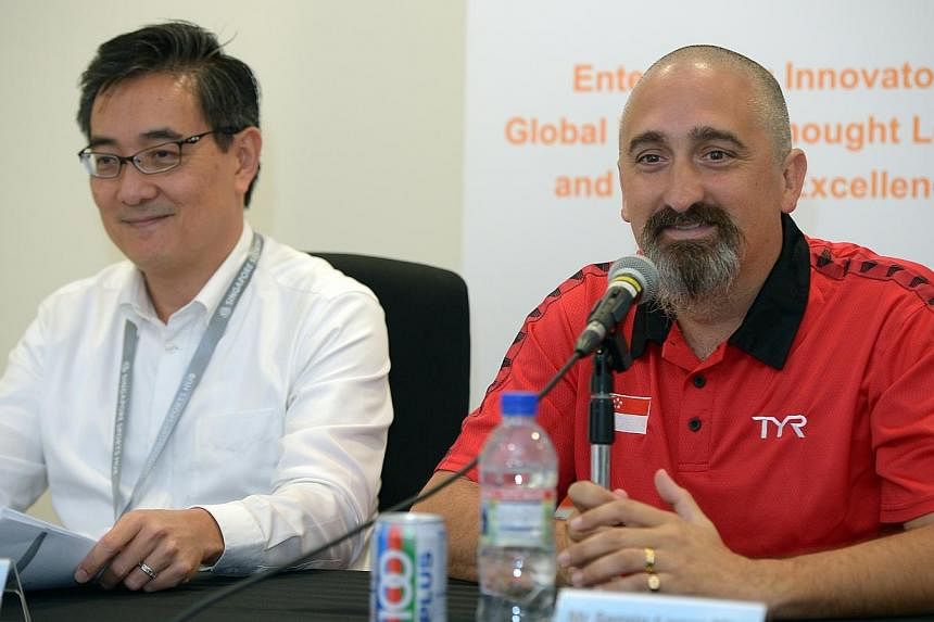 Mr Oon&nbsp;Jin Teik with Sergio Lopez as the new Head Coach of Singapore Swimming Association (SSA) during the press conference.&nbsp;-- ST PHOTO: DESMOND WEE