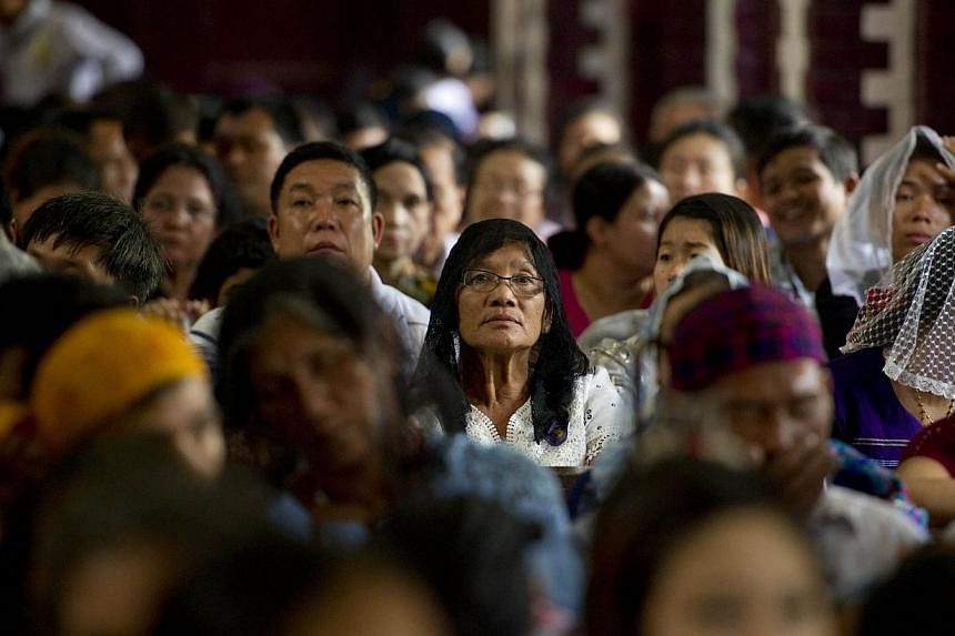 People attend the 500th Jubileee Year of the presence of Catholic Church in Myanmar in Yangon on November 21, 2014.&nbsp;Thousands of Myanmar Catholics marked 500 years of the Church's presence inside the country in a lively celebration at a Yangon c
