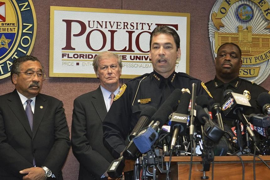 Tallahassee Police Chief Michael DeLeo (centre) speaks during a news conference at FSU campus in Tallahassee on Nov 20, 2014. Myron May, a 31-year old FSU alumnus and attorney, shot and wounded three students in the campus library before being fatall