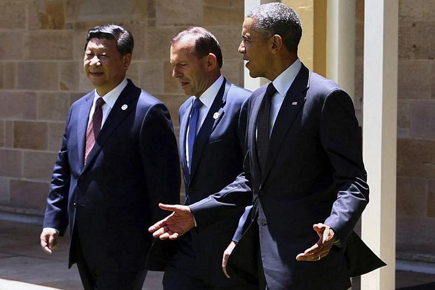 It has been a good week for Chinese President Xi Jinping, but a poor one for his US counterpart Barack Obama, seen here flanking their G-20 summit host, Australian Prime Minister Tony Abbott. Mr Xi offered signs of friendship and evidence of economic