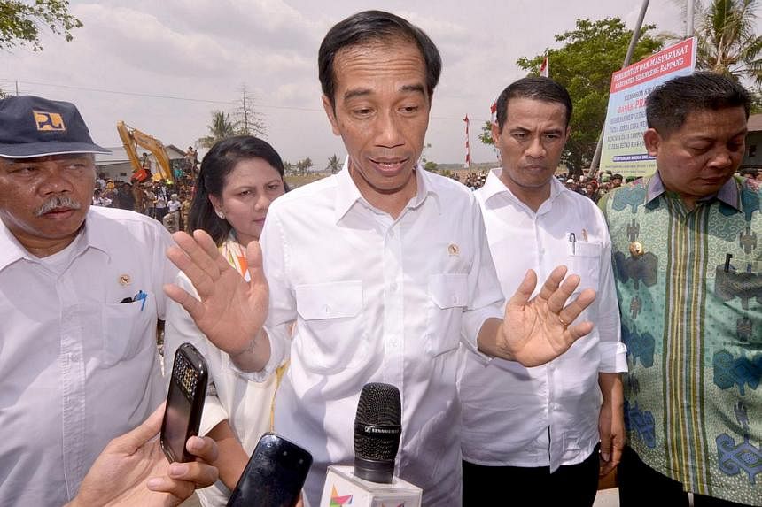 President Joko Widodo speaking to journalists after visiting farmers in a village on southern Sulawesi island. The political and business elite is coming to terms with a president who doesn't know who the main players are, nor care what they think as