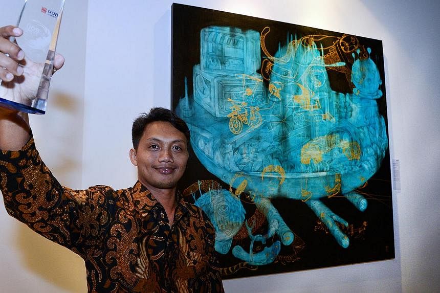 This year's big winner was Indonesian Antonius Subiyanto, 34, who bagged the UOB Painting of the Year (Indonesia) as well as the UOB South-east Asian Painting of the Year award, worth US$10,000 for his acrylic work Old Stock Fresh Menu. -- ST PHOTO: 