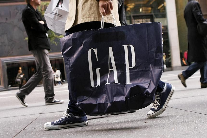 Apparel retailer Gap cut its full-year earnings forecast as sales at the Gap brand continued to fall and demand for the cheaper Old Navy clothing slowed. -- PHOTO: REUTERS