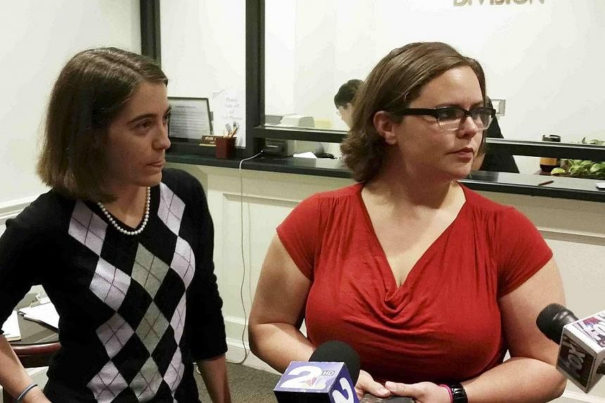 Jennifer Rose, (left), a county government employee and Sara Meadows, a teacher, filing a marriage licence application in Charleston, South Carolina on Oct 9, 2014.&nbsp;The US Supreme Court on Thursday denied a request to block gay marriage from pro