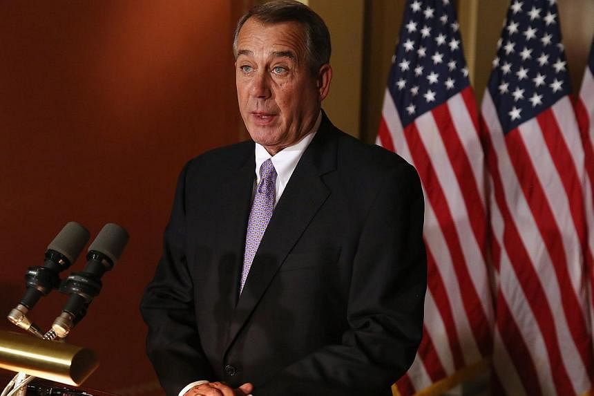 Speaker of the House John Boehner talks with reporters at his office in the US Capitol Nov 21, 2014 in Washington, DC.&nbsp;Boehner said on Friday that President Barack Obama's executive action on immigration has sabotaged chances for bipartisan legi