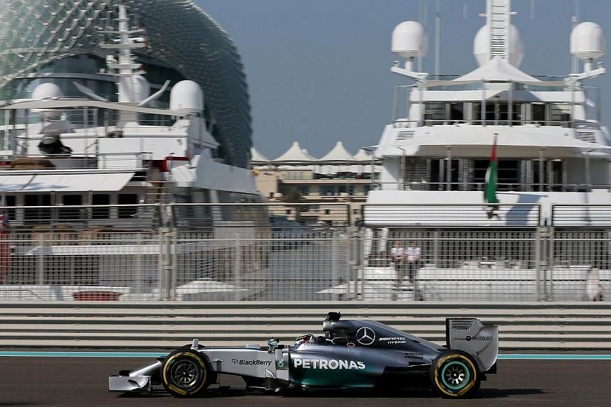 British driver Lewis Hamilton on the track for the first practice session at the Yas Marina circuit in Abu Dhabi on Nov 21, 2014. World championship leader Hamilton turned the screw to emphasise his superiority when he topped the times again ahead of