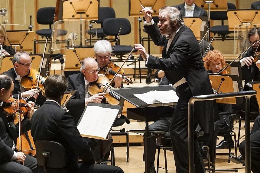 Principal conductor Valery Gergiev (centre) and the London Symphony Orchestra (LSO)&nbsp;performing at the Esplanade Concert Hall on Thursday, Nov 20.&nbsp;On Thursday, the second night of their Singapore stopover, principal conductor Valery Gergiev 
