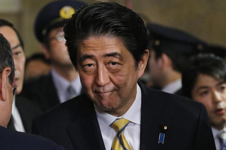 Only 39 per cent of those polled by the Asahi Shimbun daily in a poll conducted Nov 18 to Nov 19 said they supported Mr Abe, down 3 percentage points from a survey done earlier this month.&nbsp;-- PHOTO: REUTERS