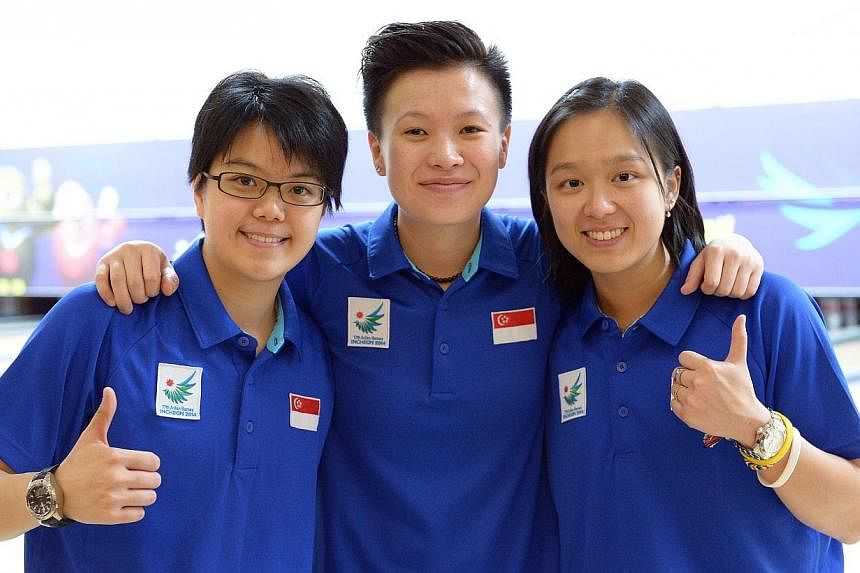 Singapore bowlers (from left) Cherie Tan, New Hui Fen and Jazreel Tan at Anyang Hogye Gymnasium in Incheon, South Korea, on Sept 28, 2014. Cherie Tan came out tops in the women's Open of the It's Daejeon International Open on Saturday. -- PHOTO: ST F