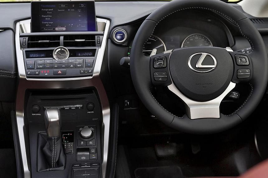 The Lexus NX300h looks sporty with its edgy design and boasts clever features such as a touch pad in the cabin.