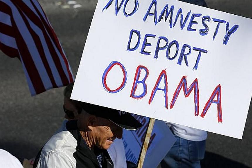 Anti-Obama protesters angered by the President's immigration plans in Las Vegas, Nevada on Nov 21, 2014. Mexico's President on Friday joined Central American leaders and Latino celebrities in applauding US President Barack Obama's landmark offer to s