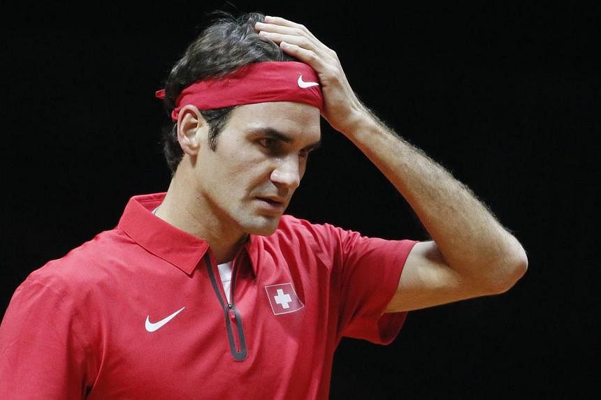 Switzerland's Roger Federer reacts during his Davis Cup final singles tennis match against France's Gael Monfils on Nov 21, 2014. Honours were shared between France and Switzerland in the Davis Cup final in Lille on Friday on a day when Roger Federer