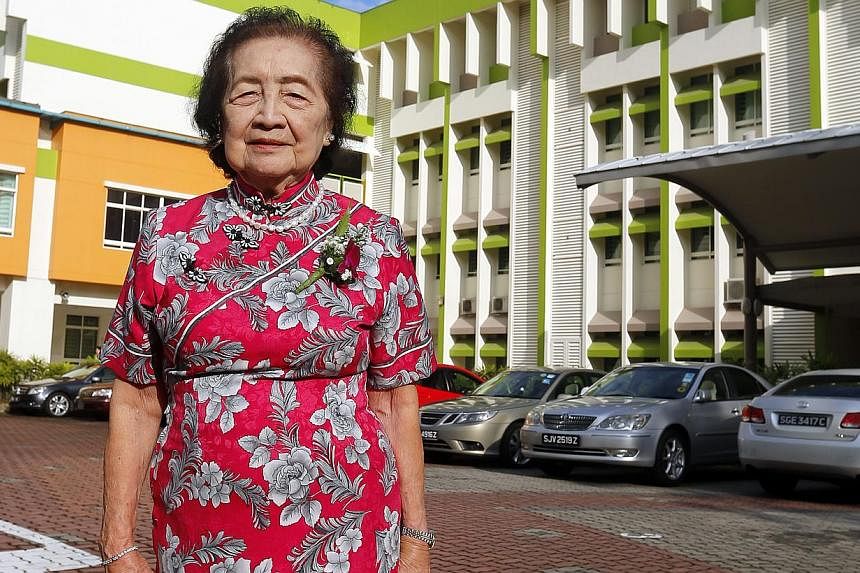 Mrs Eunice Tan was among Griffiths' first teachers when it opened in Towner Road in 1950, and was at its current location for its closing ceremony. Two generations of Qiaonan pupils taking a photo outside the school before its merger. Mr Ahmad Salik 
