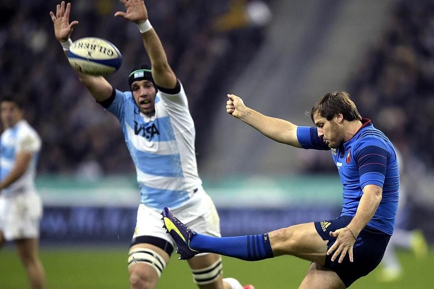 France's fly half Camille Lopez kicks the ball during the international rugby test match France versus Argentina on Nov 22, 2014 at the Stade de France in Saint-Denis, north of Paris. Argentina produced a tactical masterclass to beat France 18-13 at 