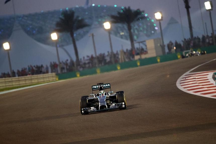 Mercedes' British driver Lewis Hamilton races during the of the Abu Dhabi Formula One Grand Prix at the Yas Marina circuit on November 23, 2014. -- PHOTO: AFP