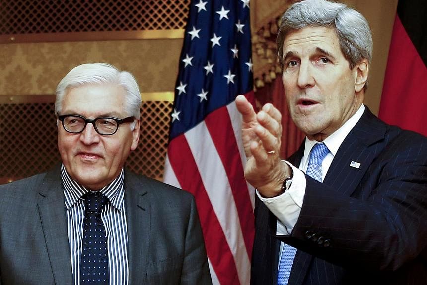 US Secretary of State John Kerry (right) and German Foreign Minister Frank-Walter Steinmeier pose for photographers before a meeting in Vienna Nov 22, 2014.&nbsp;&nbsp;The United States still hopes to get a nuclear deal with Iran by Monday's deadline