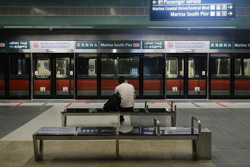 Transport Minister Lui Tuck Yew revealed yesterday that the review was under way when he opened the Marina South Pier MRT station, the southernmost stop on the North-South MRT Line and part of a $357.5 million 1km extension. -- ST PHOTO: DESMOND LIM