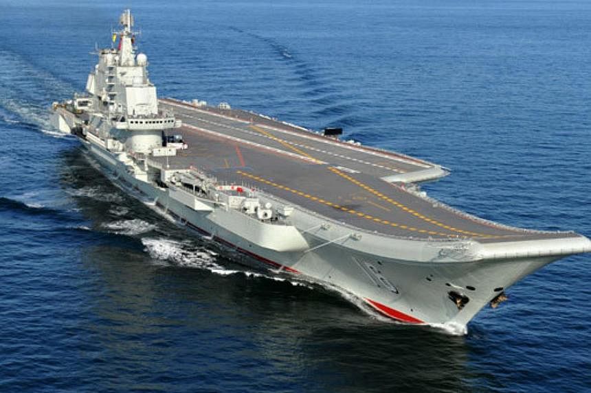 Chinese aircraft carrier Liaoning undergoing sea trials. A Chinese man has been arrested&nbsp;for taking photos of an aircraft carrier base in Qingdao and selling them to a foreigner, state broadcaster CCTV said on Saturday.&nbsp;-- PHOTO:&nbsp;CHINA