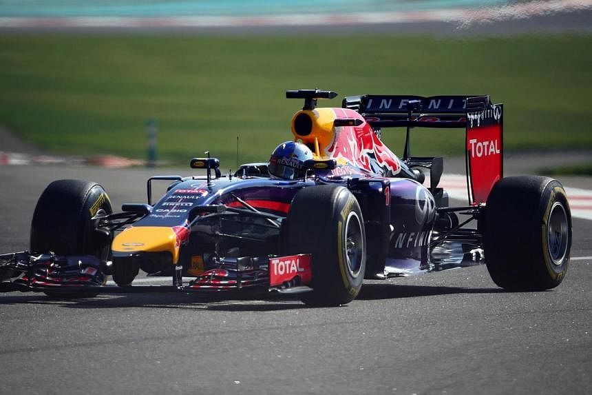 Red Bull Racing's German driver Sebastian Vettel drives during the third practice session at the Yas Marina circuit in Abu Dhabi on Nov 22, 2014 ahead of the Abu Dhabi Formula One Grand Prix. -- PHOTO: AFP