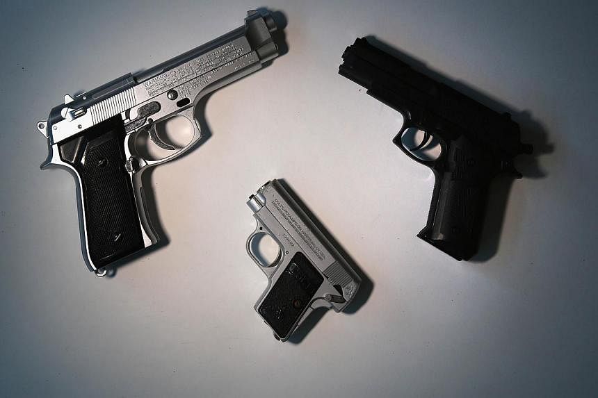 Toy guns are displayed after being confiscated at airport security checkpoints at the JFK International Airport in this file photograph. Cleveland police accidentally shot dead a 12-year-old boy who was waving a toy gun at a playground.&nbsp;-- PHOTO