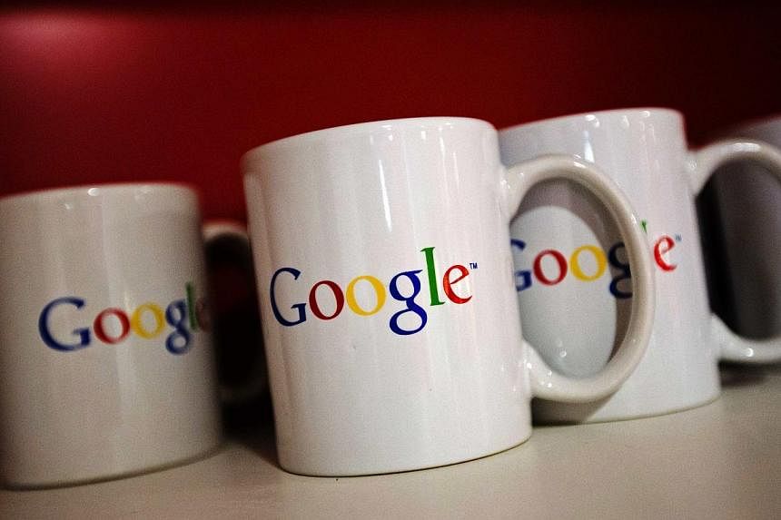 Coffee cups with Google logos are seen at the new Google office in Toronto, in this file photo taken Nov 13, 2012. -- PHOTO: REUTERS
