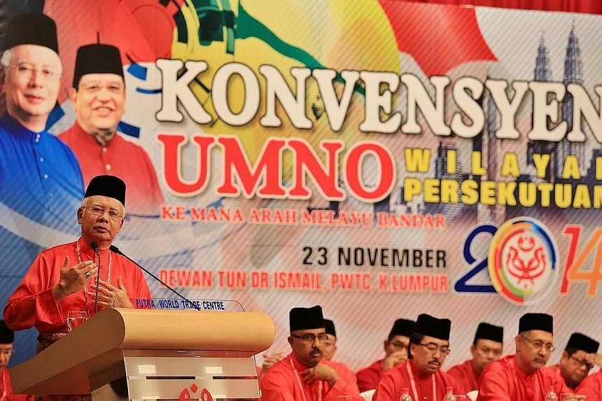 Malaysian Prime Minister Najib Razak delivering his speech at the convention in PWTC during the opening of the Federal Territories Umno convention at the Putra World Trade Centre, the last of the 13 state-level meets before the ruling party heads int