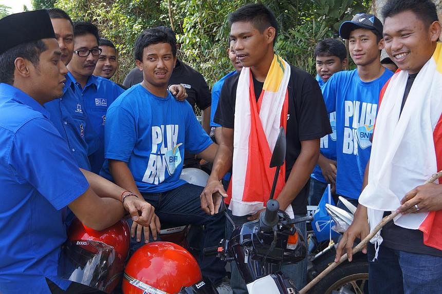 Umno Youth chief Khairy Jamaluddin (left) meeting youth grassroots workers in Pahang. Malaysia will take on the role of Asean chairman next year as the grouping grapples with the challenge of fulfilling the dreams of its youth.