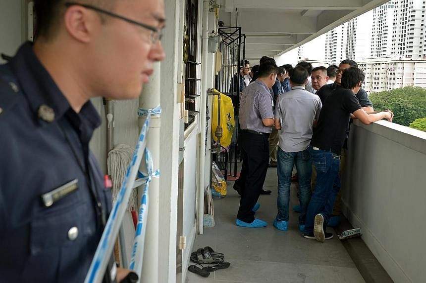 The scene of the crime is a unit on the 9th floor of Block 406, Ang Mo Kio Ave 10. -- ST PHOTO: KUA CHEE SIONG