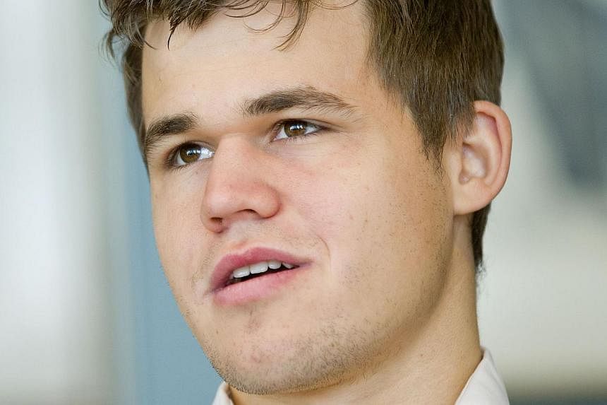 Norwegian prodigy Magnus Carlsen retained his title as World Chess Champion on Sunday, defeating rival Viswanathan Anand for the second year in a row. -- PHOTO: AFP