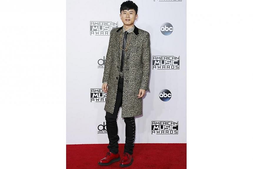 Chinese singer Zhang Jie is one of the few people who dressed for winter. No one briefed him that on the red carpet in America, it is always summer.&nbsp;-- PHOTO: REUTERS