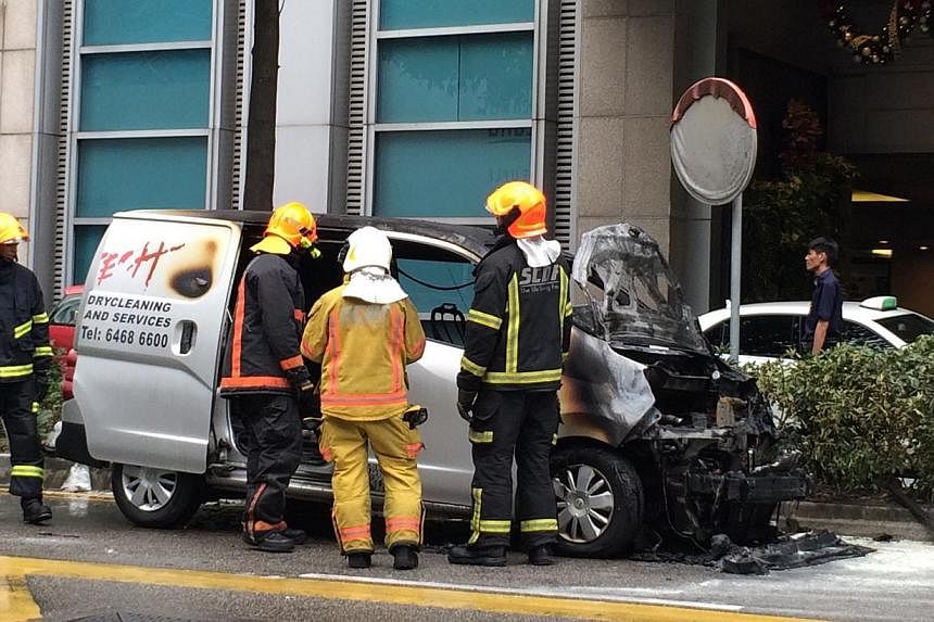 A van caught fire outside Paragon Shopping Centre on Orchard Road on Monday. No one was injured. --&nbsp;ST PHOTO: NG SOR LUAN