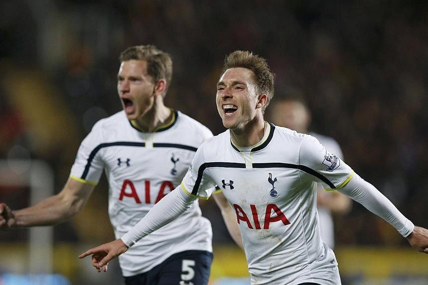 Tottenham Hotspur's Christian Eriksen (R) celebrates scoring a goal with team-mate Jan Vertonghen during their English Premier League soccer match against Hull City at the KC Stadium in Hull, northern England Nov 23, 2014 .-- PHOTO: REUTERS