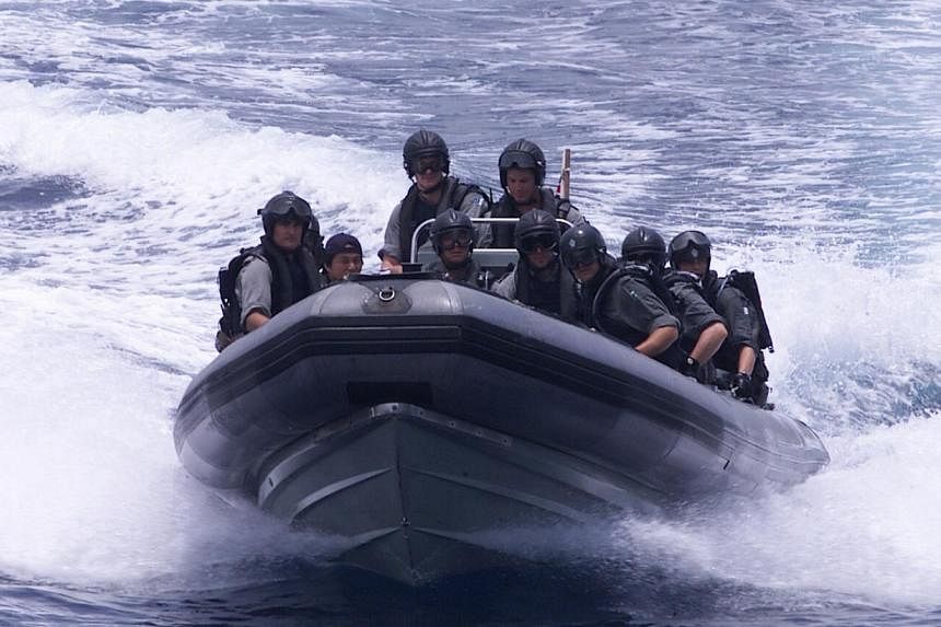 Joint operations in the Strait of Malacca to counter piracy.--PHOTO: ZAOBAO