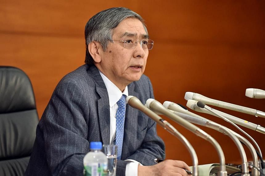 Bank of Japan Governor Haruhiko Kuroda warns of some weaknesses in the economy and stressed the central bank's readiness to ease monetary policy further. PHOTO: AFP&nbsp;