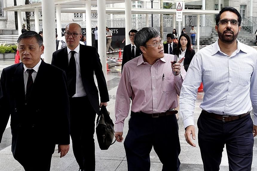 (From left) Defence lawyers Peter Low and Terence Tan together with Mr Png Eng Huat and Mr Pritam Singth&nbsp;of the Workers' Party.&nbsp;The verdict in the trial of the Workers' Party (WP) town council for allegedly flouting the law in holding a Chi