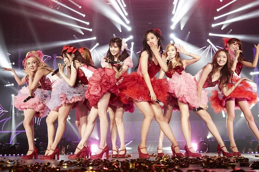 K-pop group Girls' Generation performing in Seoul. Chinese e-commerce giant Alibaba is planning a major investment worth at least 100 billion won (S$120 million) in South Korea's SM Entertainment, the agent for the likes of Super Junior, EXO and Girl