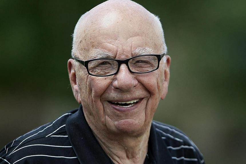 Sun owner Rupert Murdoch smiles during a visit to Sun Valley, Idaho in this file photo taken in July, 2014. -- PHOTO: REUTERS