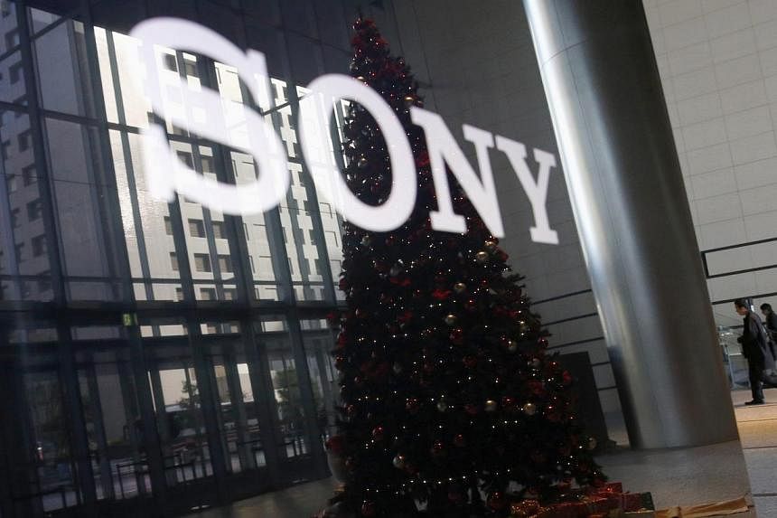 The Sony logo and a Christmas tree are reflected on the company's 4K television set at the company's headquarters in Tokyo on Nov 18, 2014. Sony said it is aiming to garner up to US$11 billion (S$14.3 billion) in revenue from its movie business in th