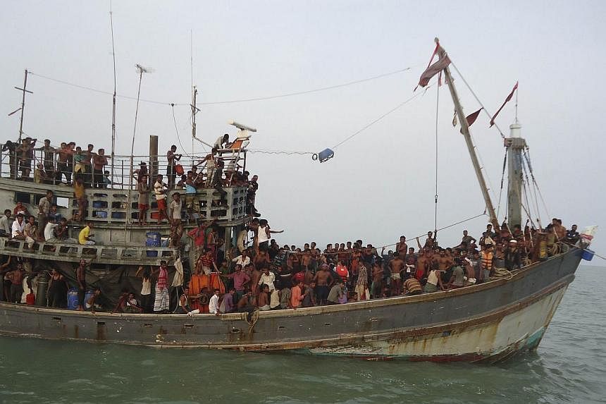 Suspected human trafficking victims crammed on a Thai trawler, which was rescued by the Bangladesh Coast Guard on June 11, 2014. The 2014 Global Slavery Index estimated that almost 36 million people around the world are in some form of slavery. --PHO