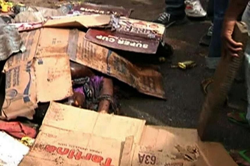 A screen grab taken from a video released by TVC News shows the body of a women killed in a twin bomb blasts in a market in the northeast Nigerian city of Maiduguri on Nov 25, 2014.&nbsp;More than 45 people were killed when two female suicide bombers