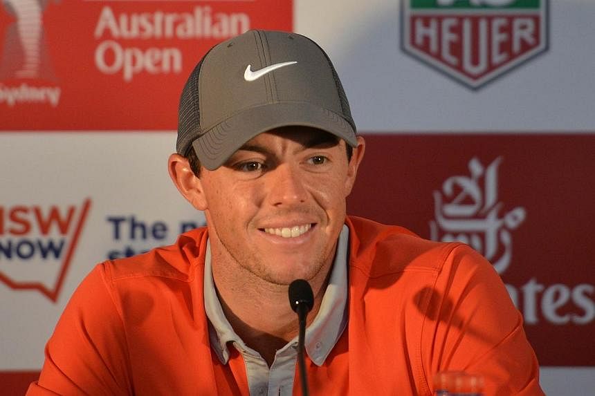 World No. 1 Rory McIlroy returns to defend his Australian Open title this week with Adam Scott itching for revenge after last year's final-hole anguish. -- PHOTO: AFP
