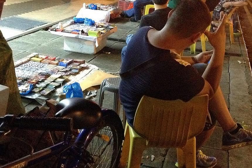 Sex drug peddlers selling &nbsp;their wares in Geylang Road, off Lorong 23, and Junction of Aljunied Road. -- ST PHOTO:&nbsp;DESMOND WEE